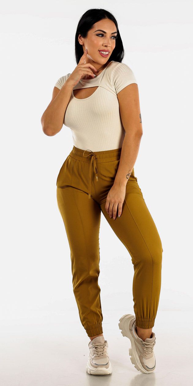 High Rise Athleisure Joggers with Short Sleeve Cut Out Cream Bodysuit sold by Moda