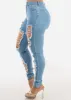 Super High Waist Distressed Skinny Jeans Light Wash sold by Moda