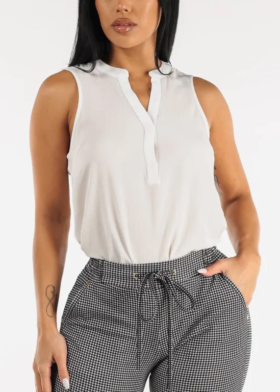 White Sleeveless Half Button Up Blouse sold by Moda