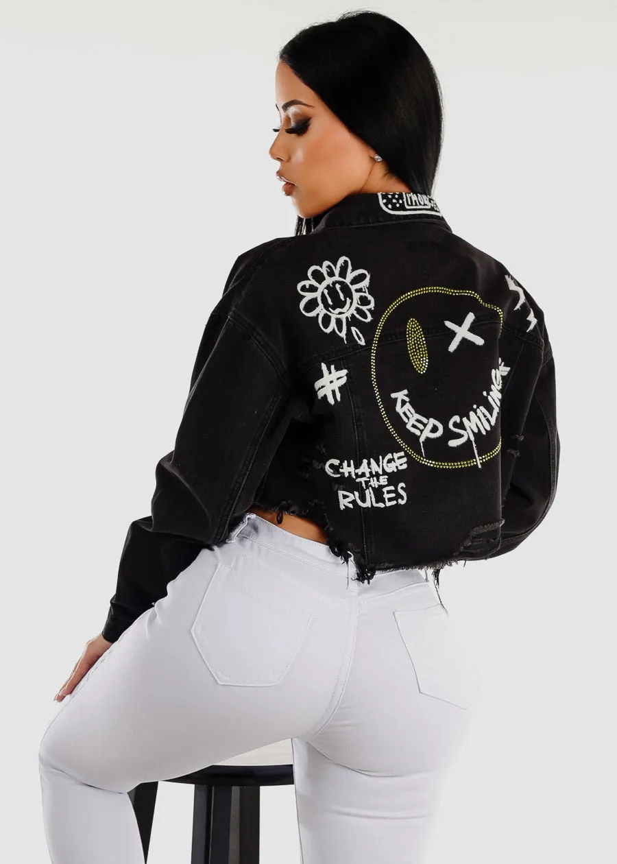 Black Graphic Cropped Denim Jacket "Keep Smiling" sold by Moda