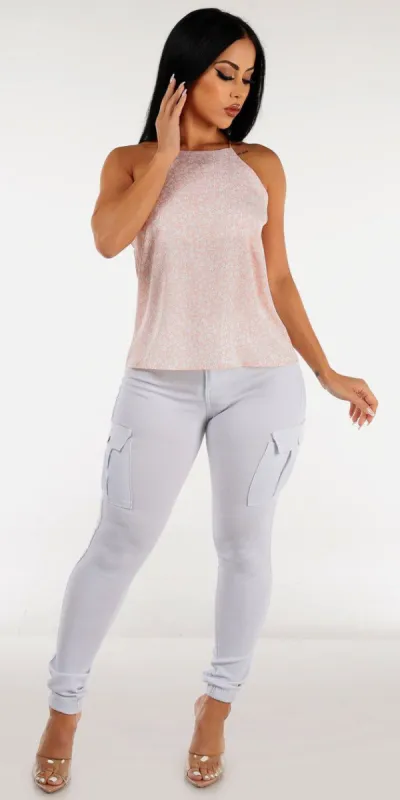 White Hyper Stretch Cargo Joggers with Sleeveless Pink Halter Floral Cami Top sold by Moda