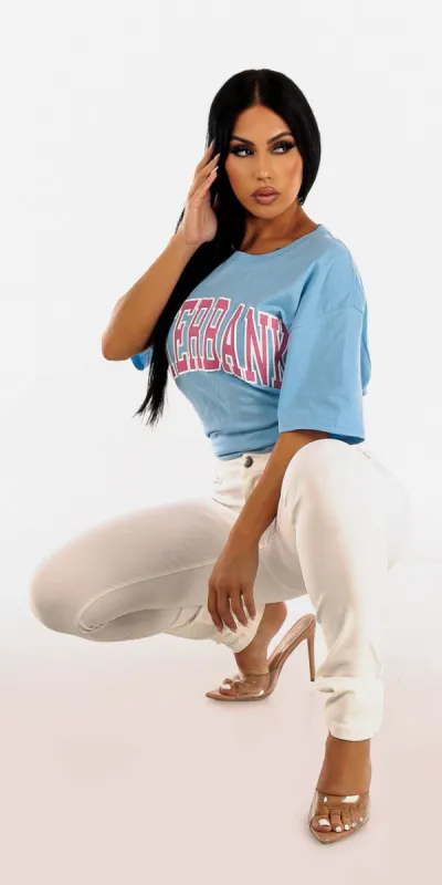Levantacola High Stretch White Skinny Pants with Blue Oversized Crew Neck Graphic Tee sold by Moda