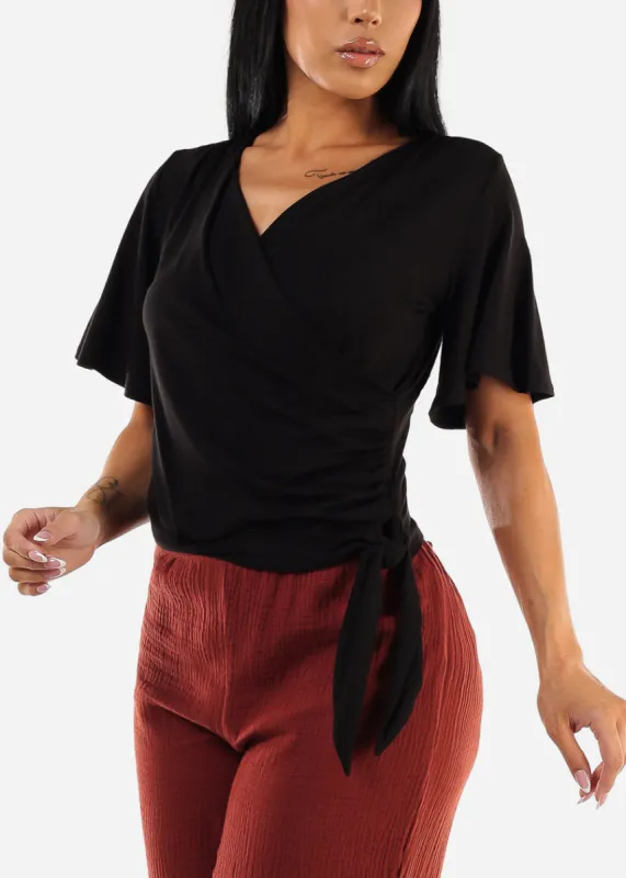 Black Short Sleeve Surplice Blouse sold by Moda