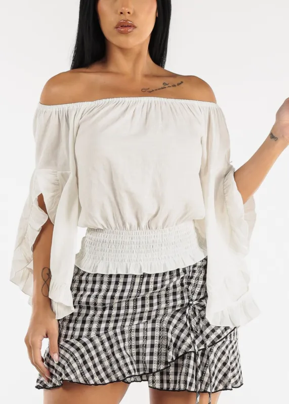Off Shoulder Smocked Hem Top w Ruffle Bell Sleeves sold by Moda