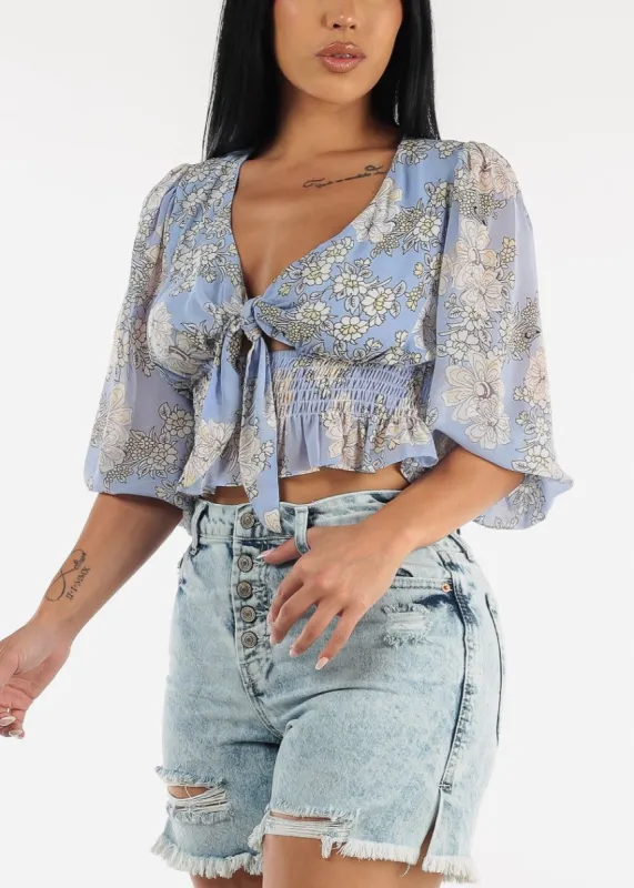 Front Knot Ruffle Hem Floral Crop Top Blue sold by Moda