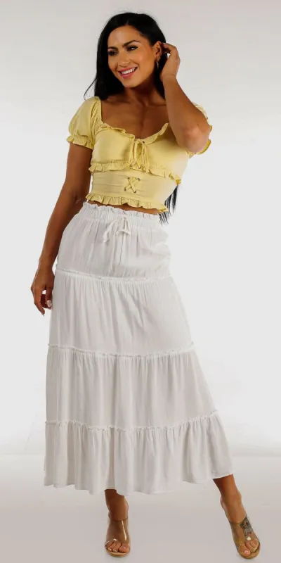 White Ruffle Tiered Maxi Skirt with Yellow Ruffled Lace Up Crop Top sold by Moda