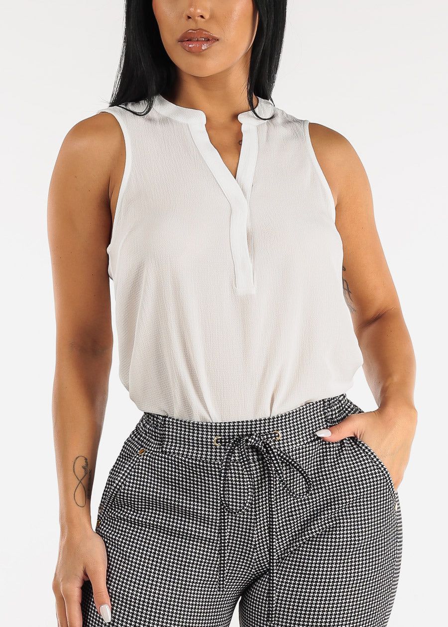 White Sleeveless Half Button Up Blouse sold by Moda