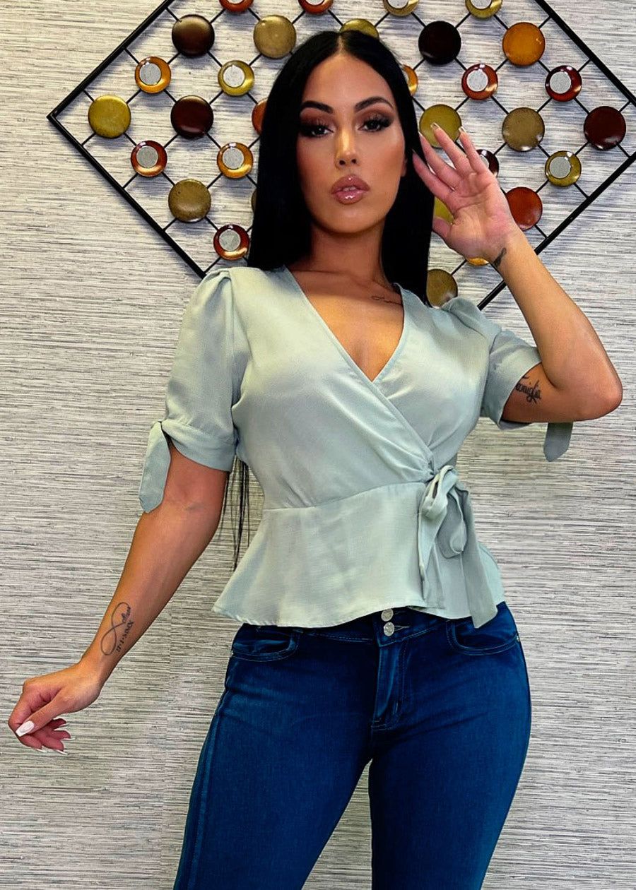 Short Sleeve Self Tie Peplum Blouse Sage sold by Moda