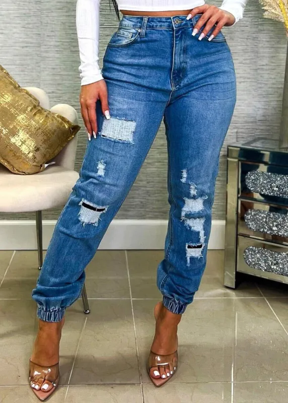 High Waisted Patched Denim Joggers Light Blue sold by Moda