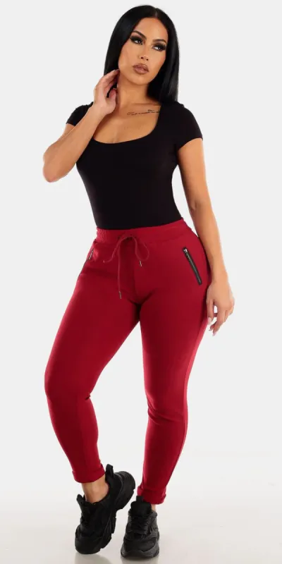 High Waisted Cuffed Burgundy Skinny Pants with Black Short Sleeve Thong Bodysuit sold by Moda