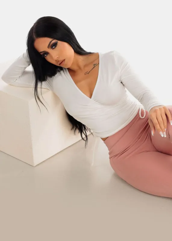 White Long Sleeve Surplice Crop Top w Ruched Sides sold by Moda