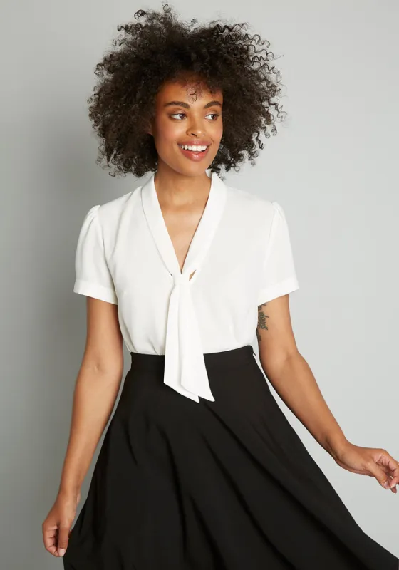 Polished and Playful Tie-Neck Blouse sold by Modcloth