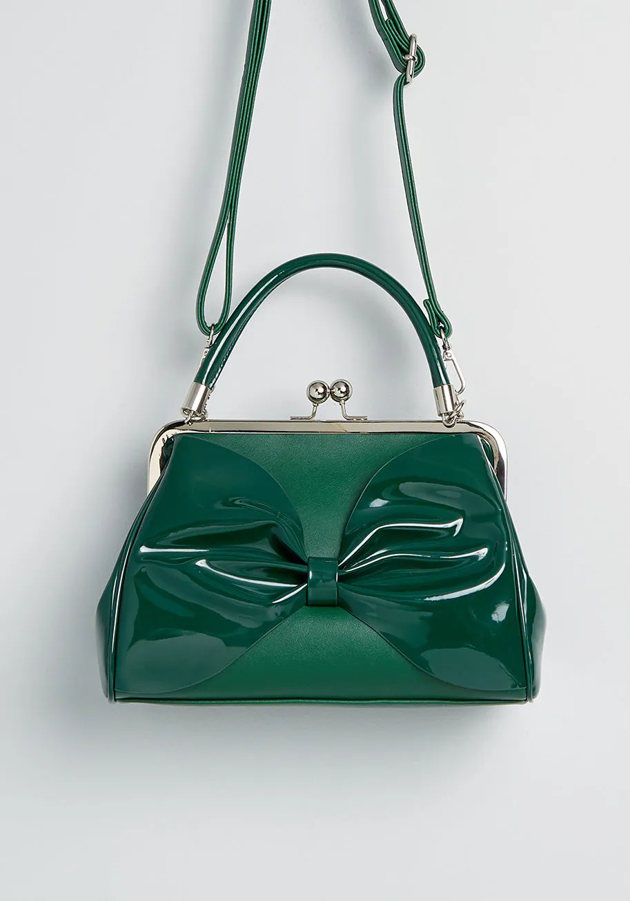 Bow on the Go Crossbody Bag sold by Modcloth