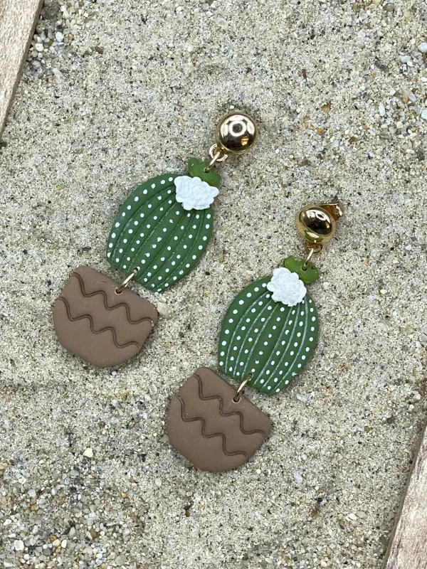 Barrel Cactus with White Flower Earrings sold by Modcloth