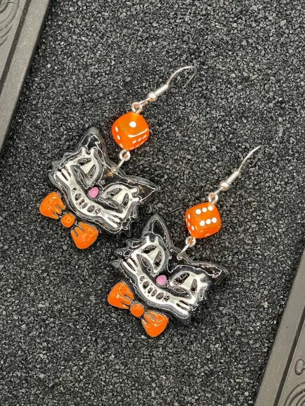 Retro Black Cat with Bowtie Earrings sold by Modcloth