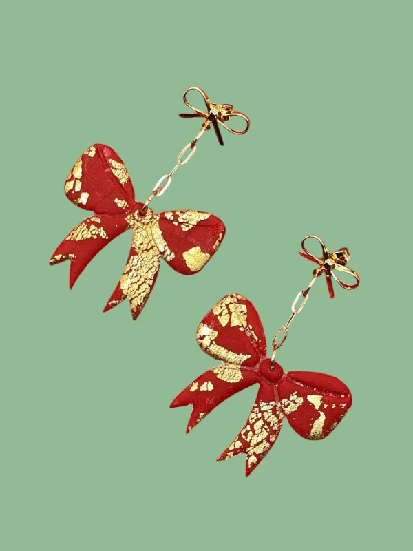 Red & Gold Bow Earrings sold by Modcloth
