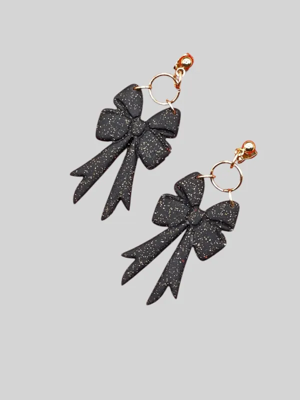 Black Sparkle Bow Earrings sold by Modcloth