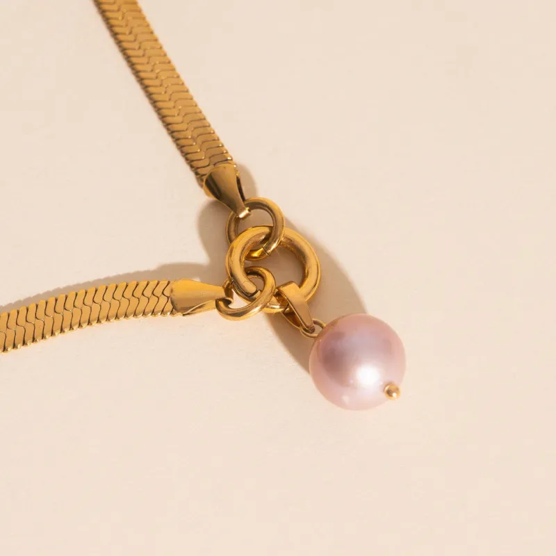 Pink Pearl Necklace Charm sold by Modcloth