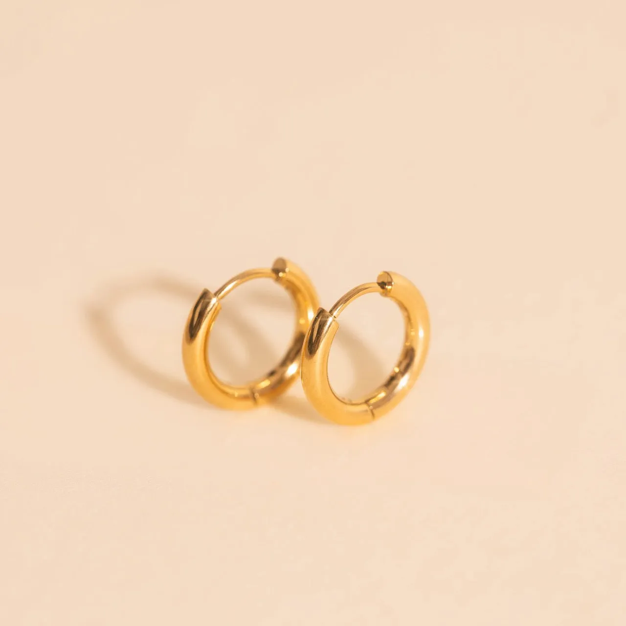 Mini Rounded Huggie Hoop Earrings sold by Modcloth