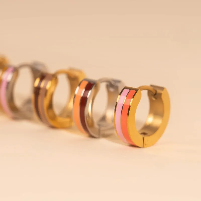 Striped Chunky Huggie Hoop Earrings sold by Modcloth