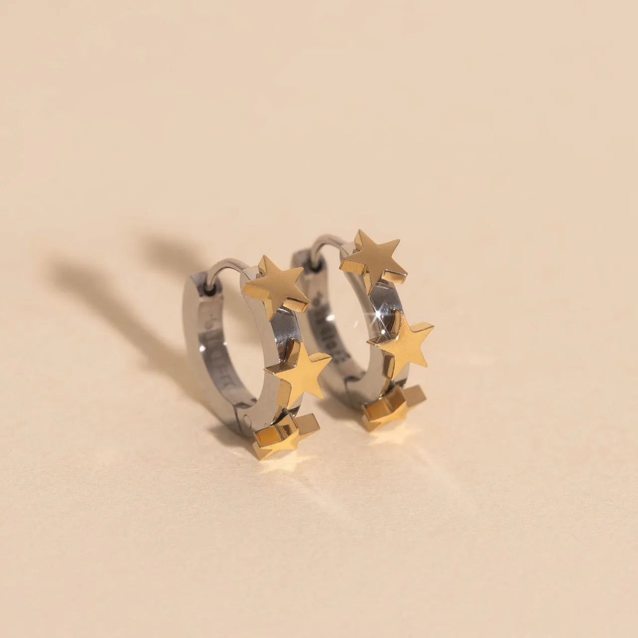 Star 3D Huggie Hoop Earrings sold by Modcloth