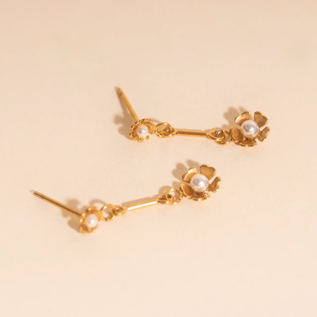 Pearl Flower Dangle Stud Earrings sold by Modcloth
