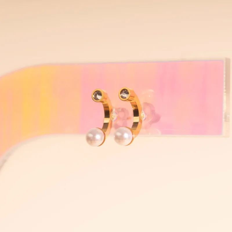 Arc and Pearl Stud Earrings sold by Modcloth