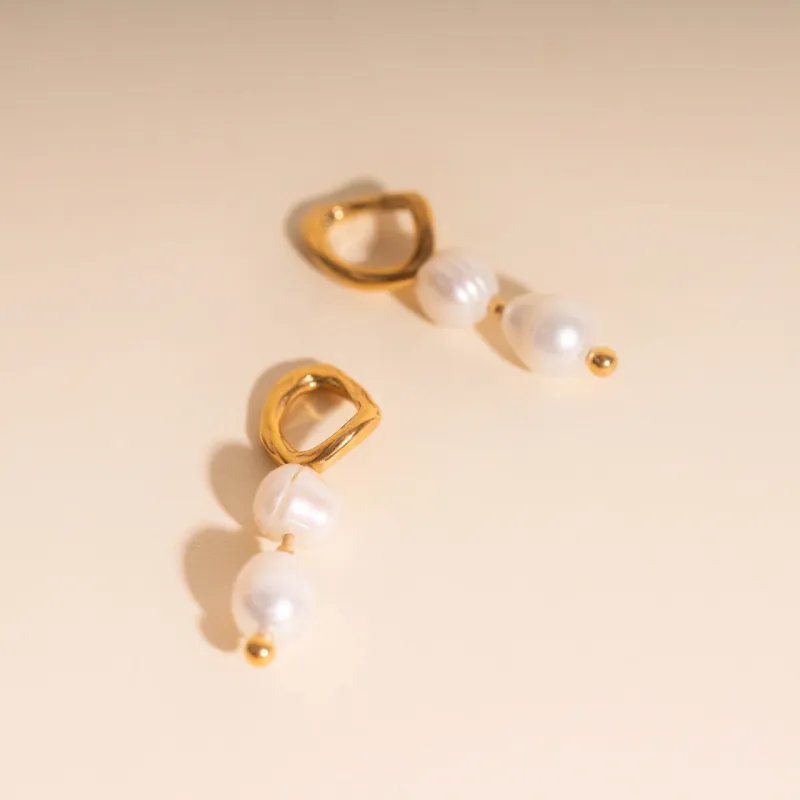 Ripple Pearl Huggie Hoop Charms sold by Modcloth