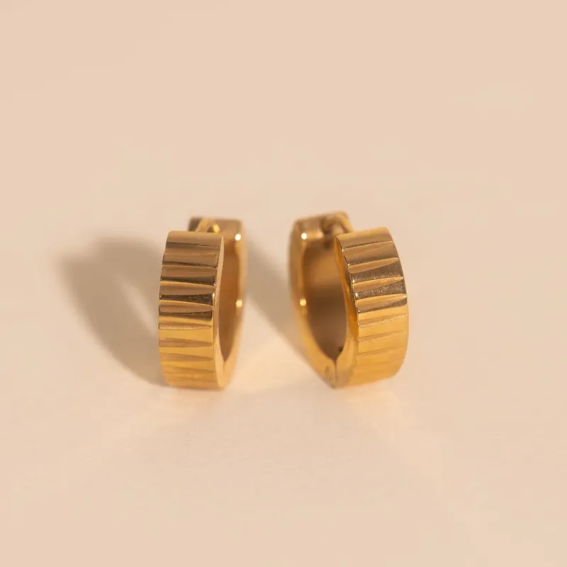 Textured Chunky Huggie Hoop Earrings sold by Modcloth