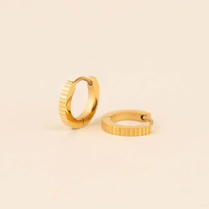 Textured Huggie Hoop Earrings sold by Modcloth
