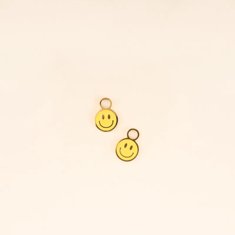 Smiley Huggie Hoop Charms sold by Modcloth