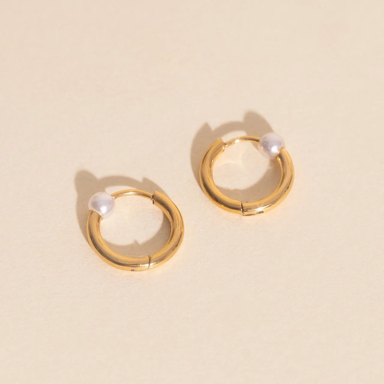 Pearl Huggie Hoop Earrings sold by Modcloth