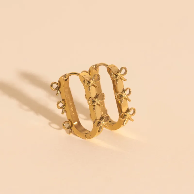 Stacked Rope Bow Oblong 3D Huggie Hoop Earrings sold by Modcloth