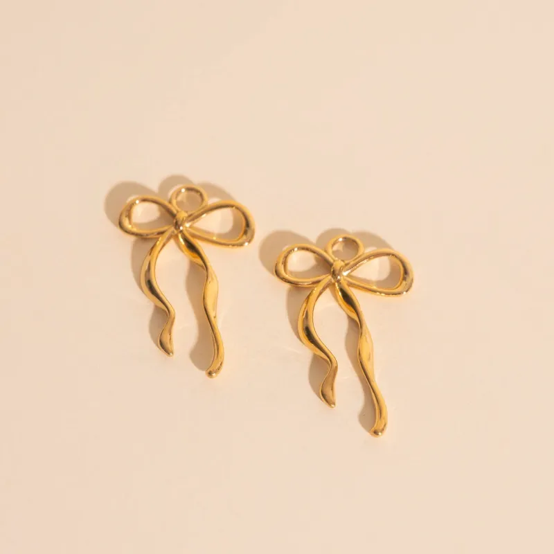 Ribbon Bow Huggie Hoop Charms sold by Modcloth