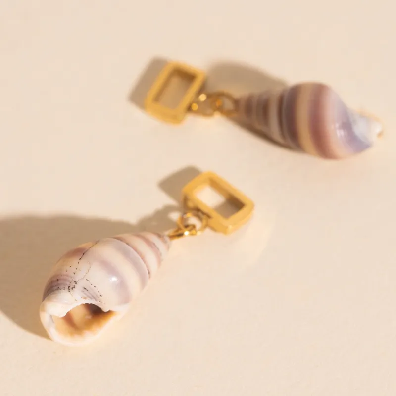 Spiral Shell Chunky Huggie Hoop Charms sold by Modcloth