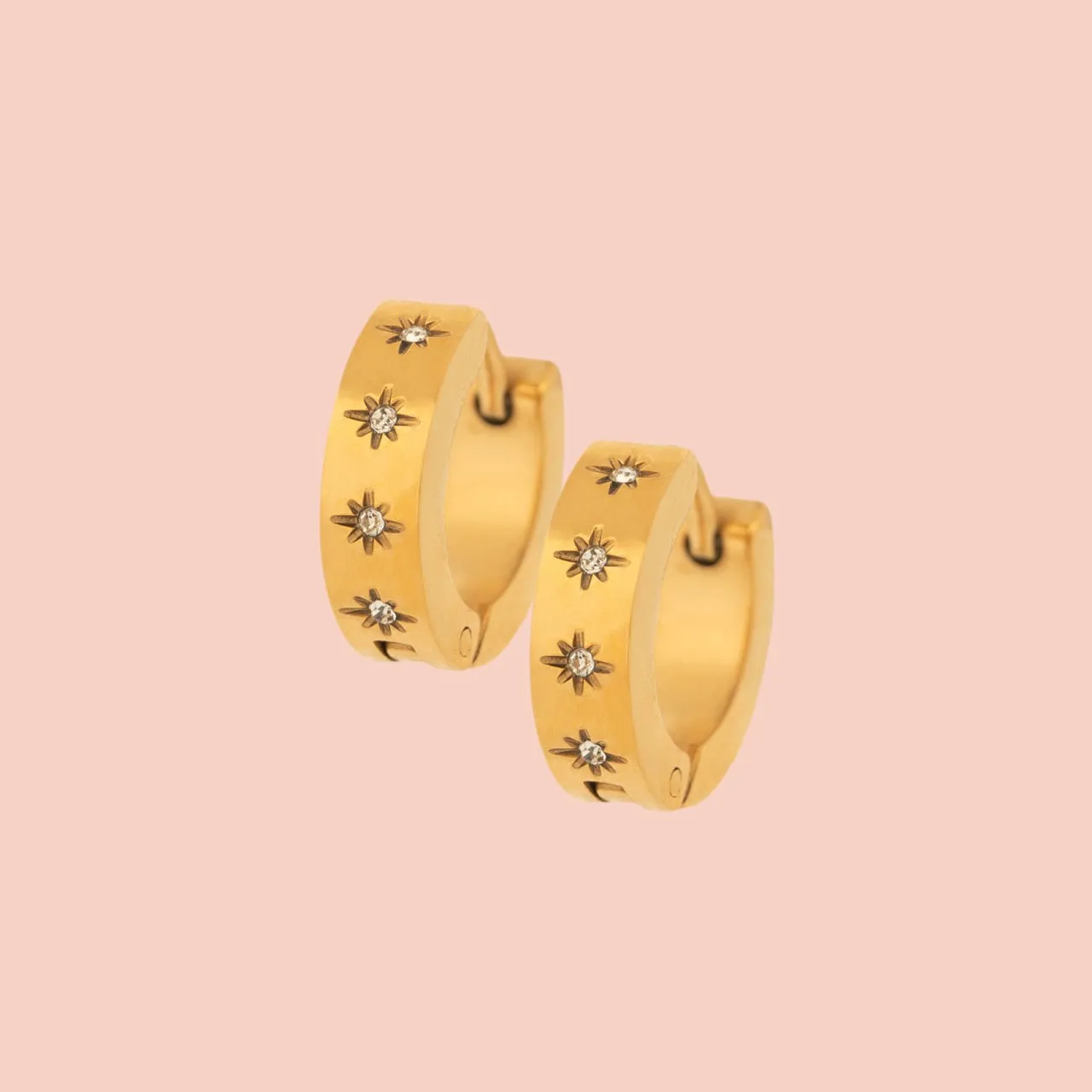 Starburst Chunky Huggie Hoop Earrings sold by Modcloth