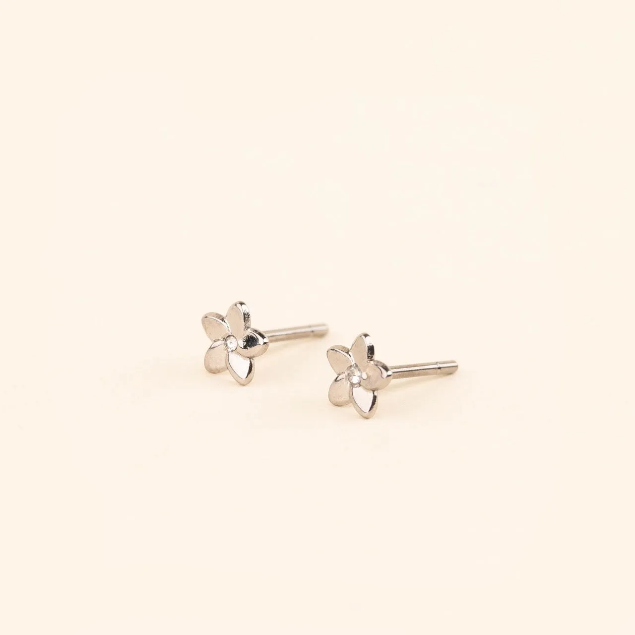 Mini Plumeria Flower Stud Earrings sold by Modcloth