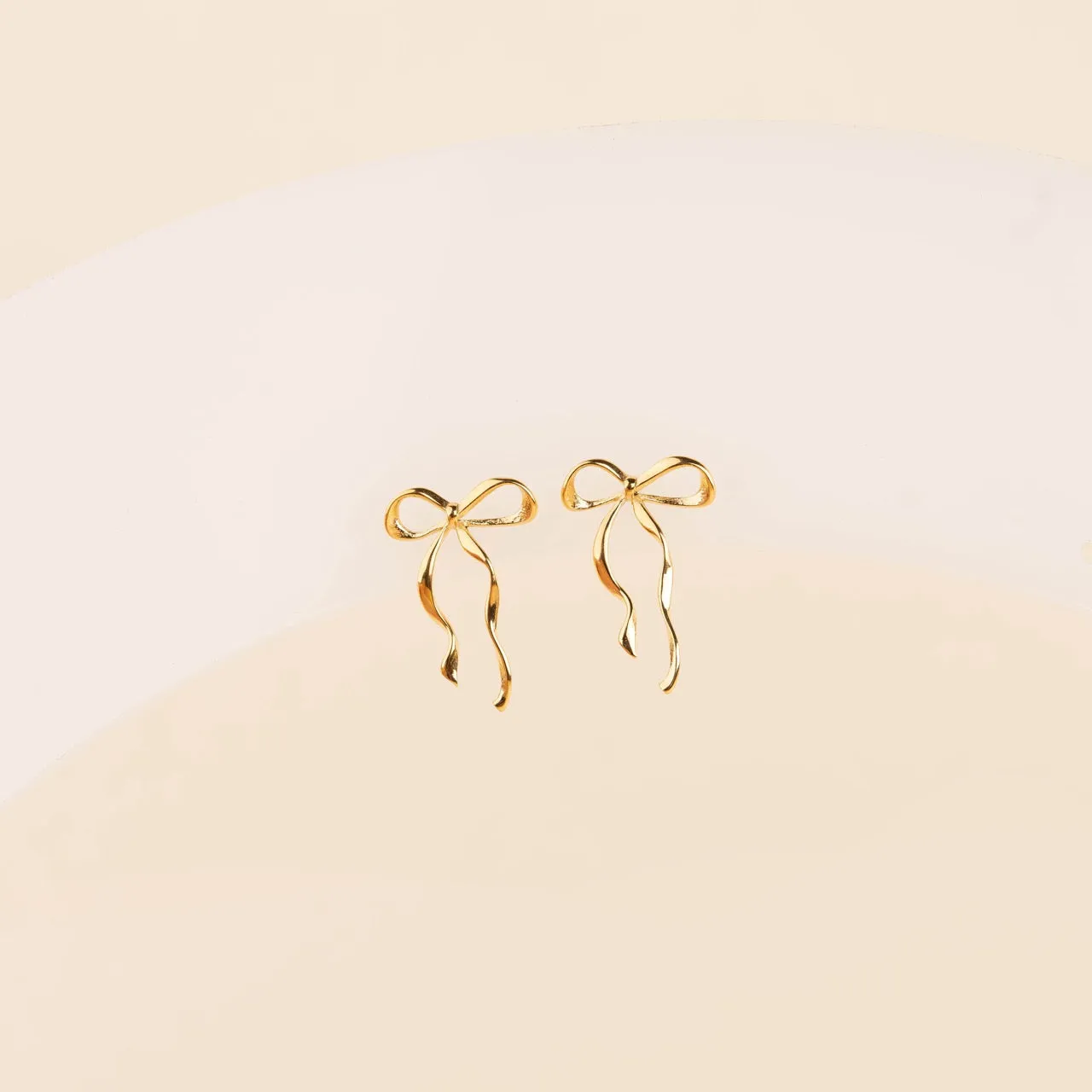 Dainty Bow Stud Earrings sold by Modcloth