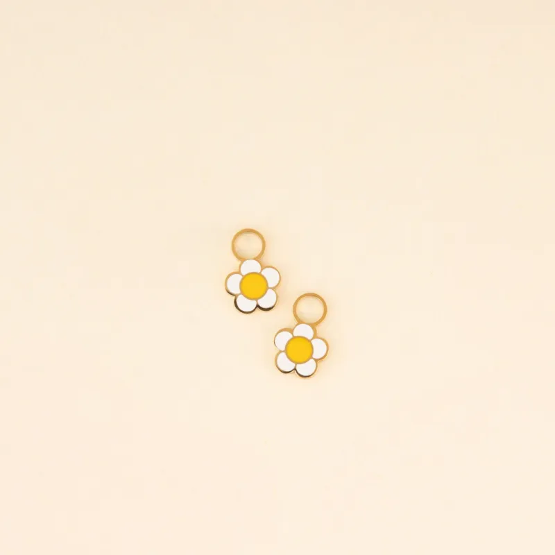 White Flower Huggie Hoop Charms sold by Modcloth