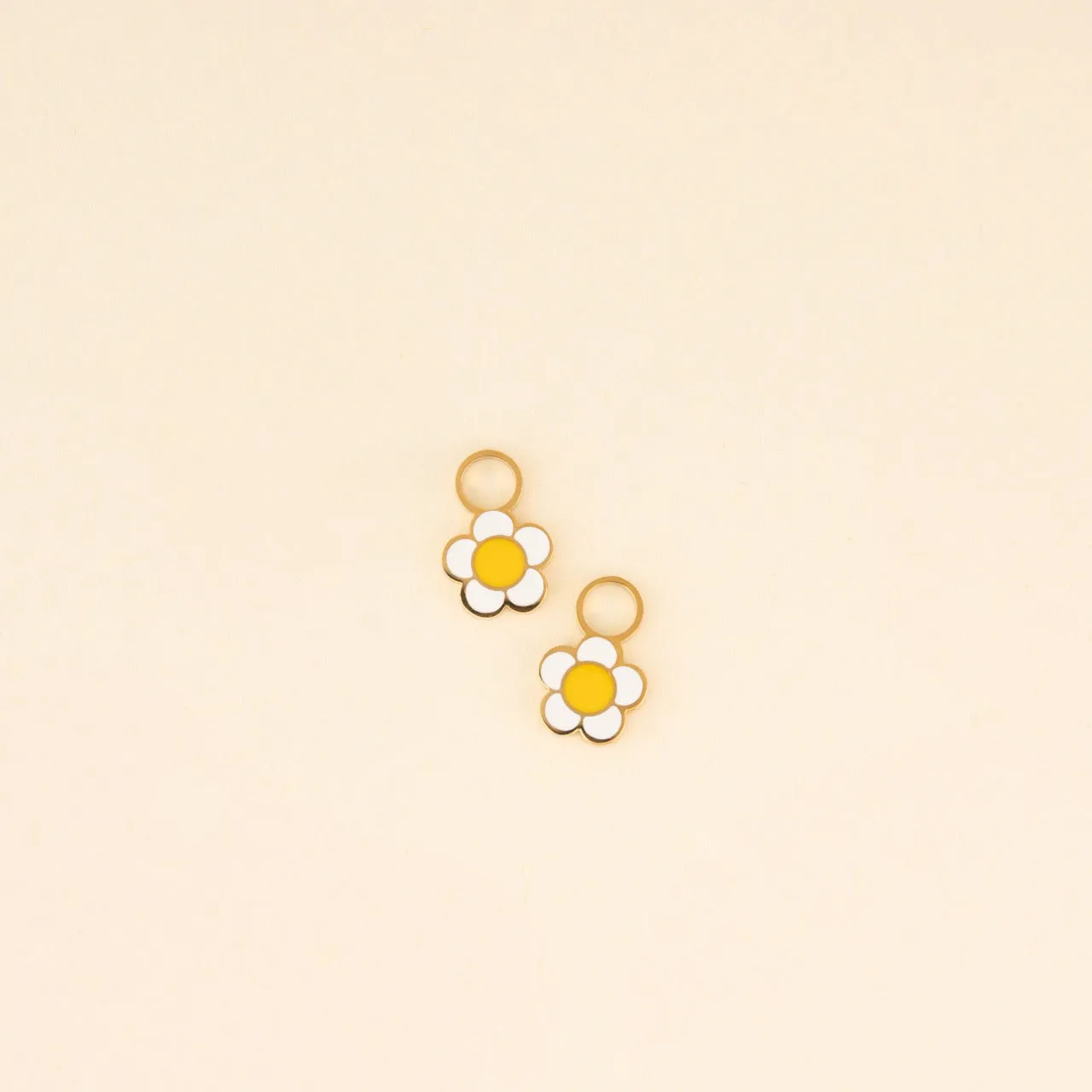 White Flower Huggie Hoop Charms sold by Modcloth