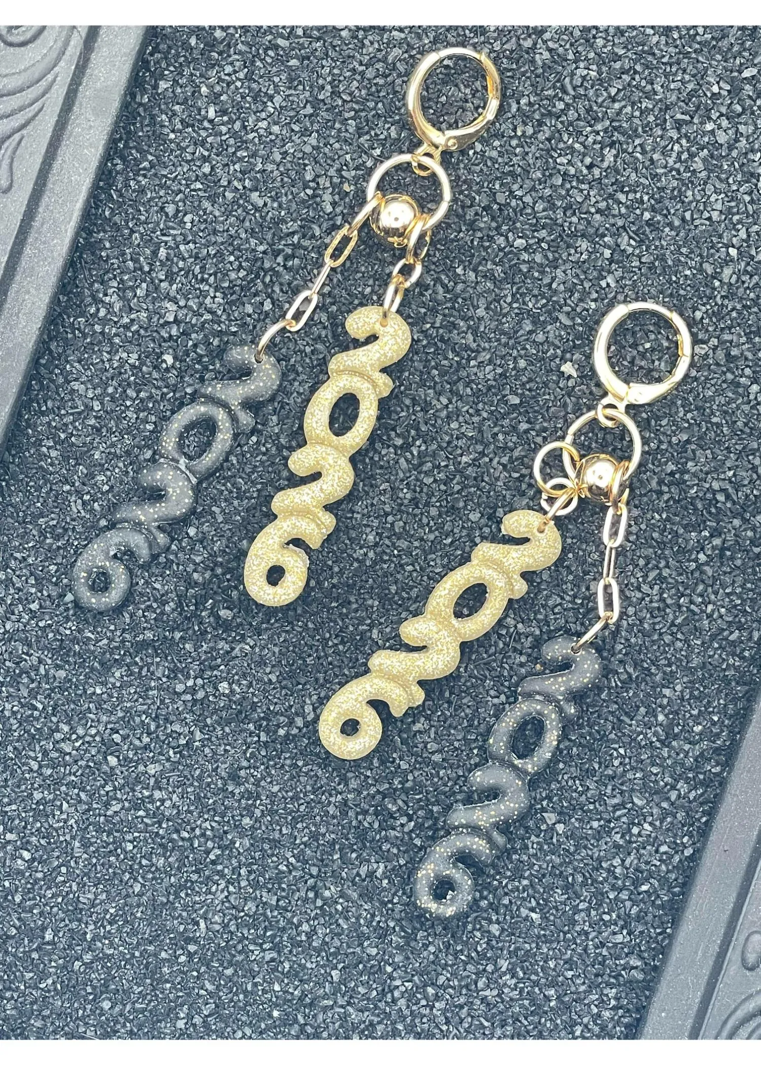 Jump Into 2026 Sparkly Black Earrings sold by Modcloth