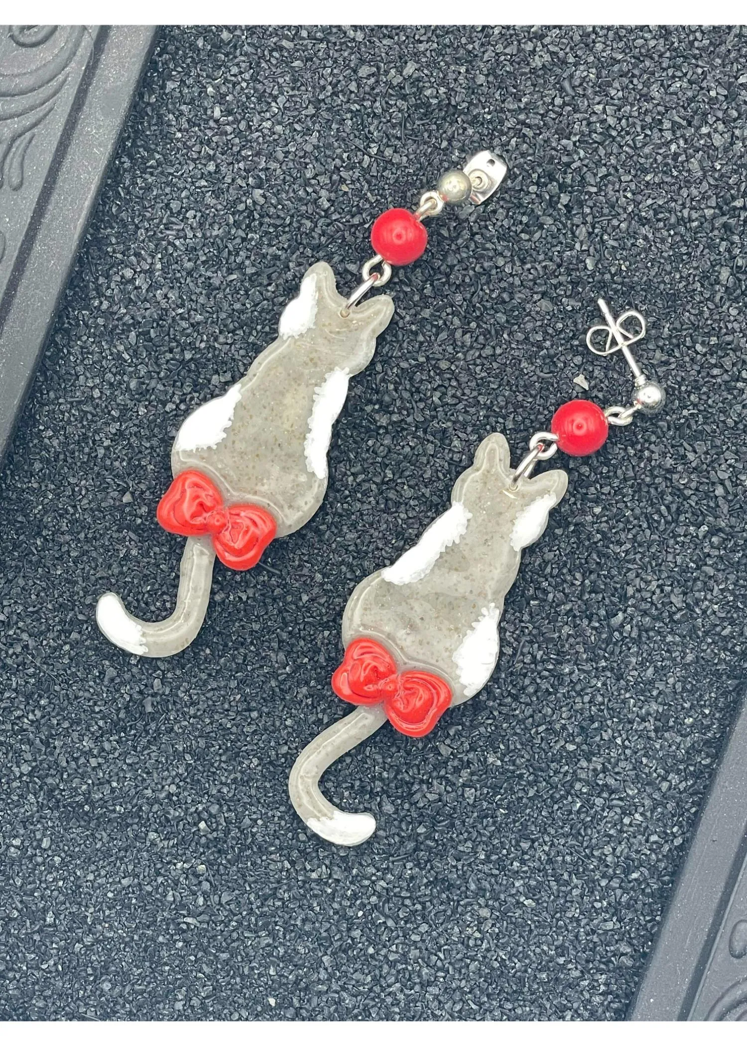 Grey Kitty Cat with Red Bow Earrings sold by Modcloth
