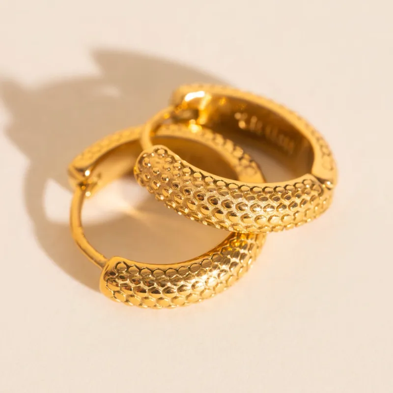 Snake Chunky Huggie Hoop Earrings sold by Modcloth