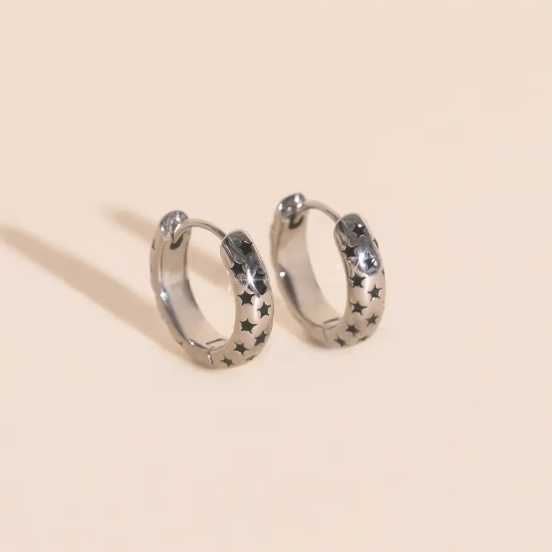 Black Star Chunky Huggie Hoop Earrings sold by Modcloth