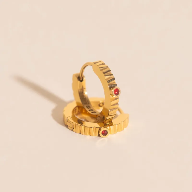 Red Crystal Textured Huggie Hoop Earrings sold by Modcloth