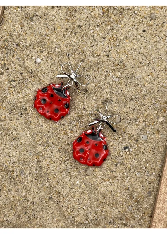 Lady Bug Dangle Earrings with Bow sold by Modcloth