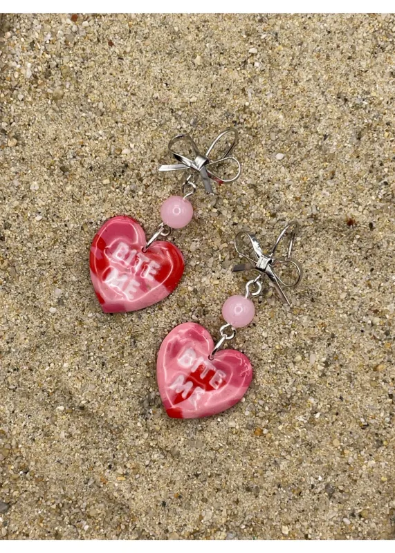 Bite Me Candy Heart Earrings sold by Modcloth