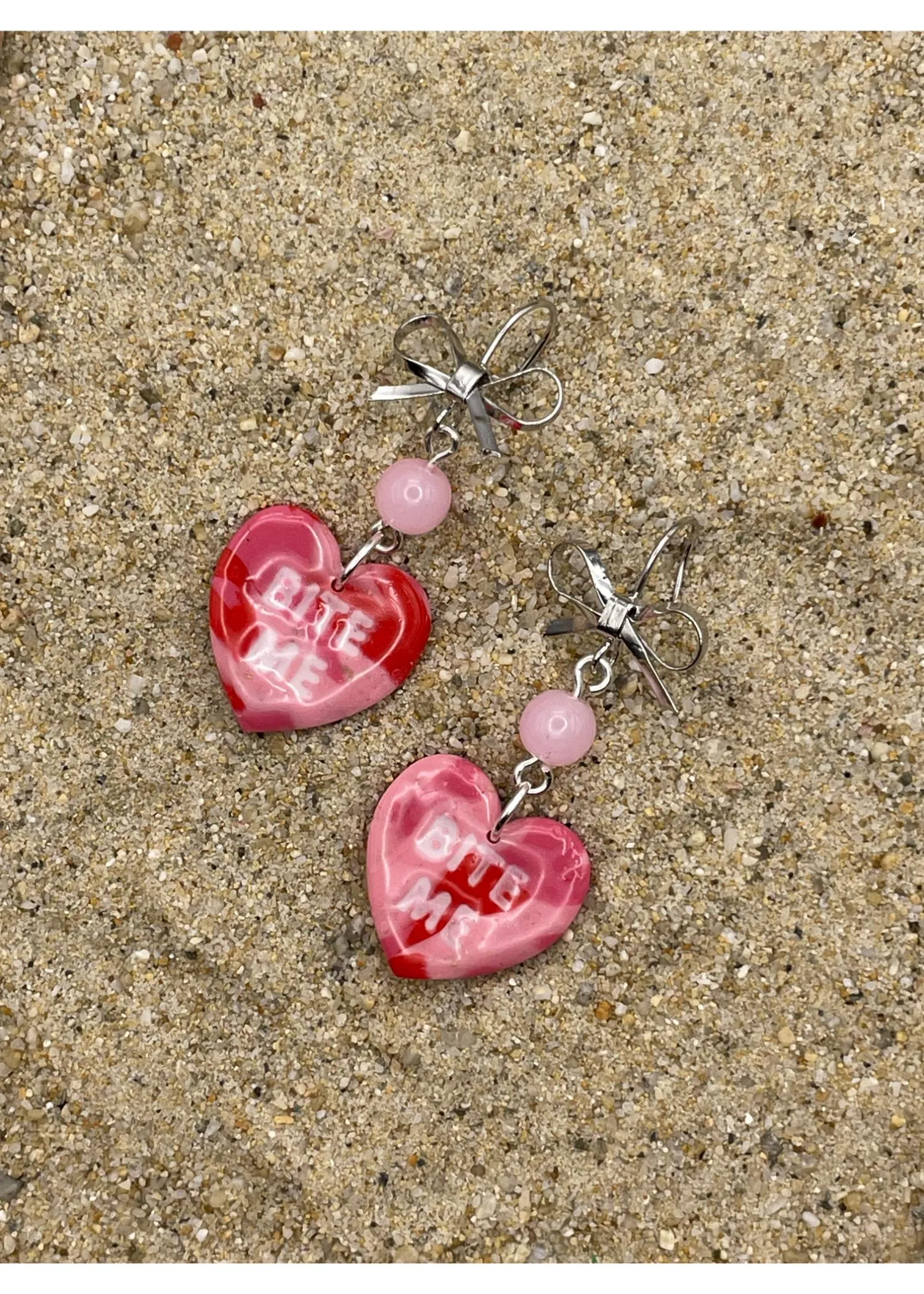 Bite Me Candy Heart Earrings sold by Modcloth