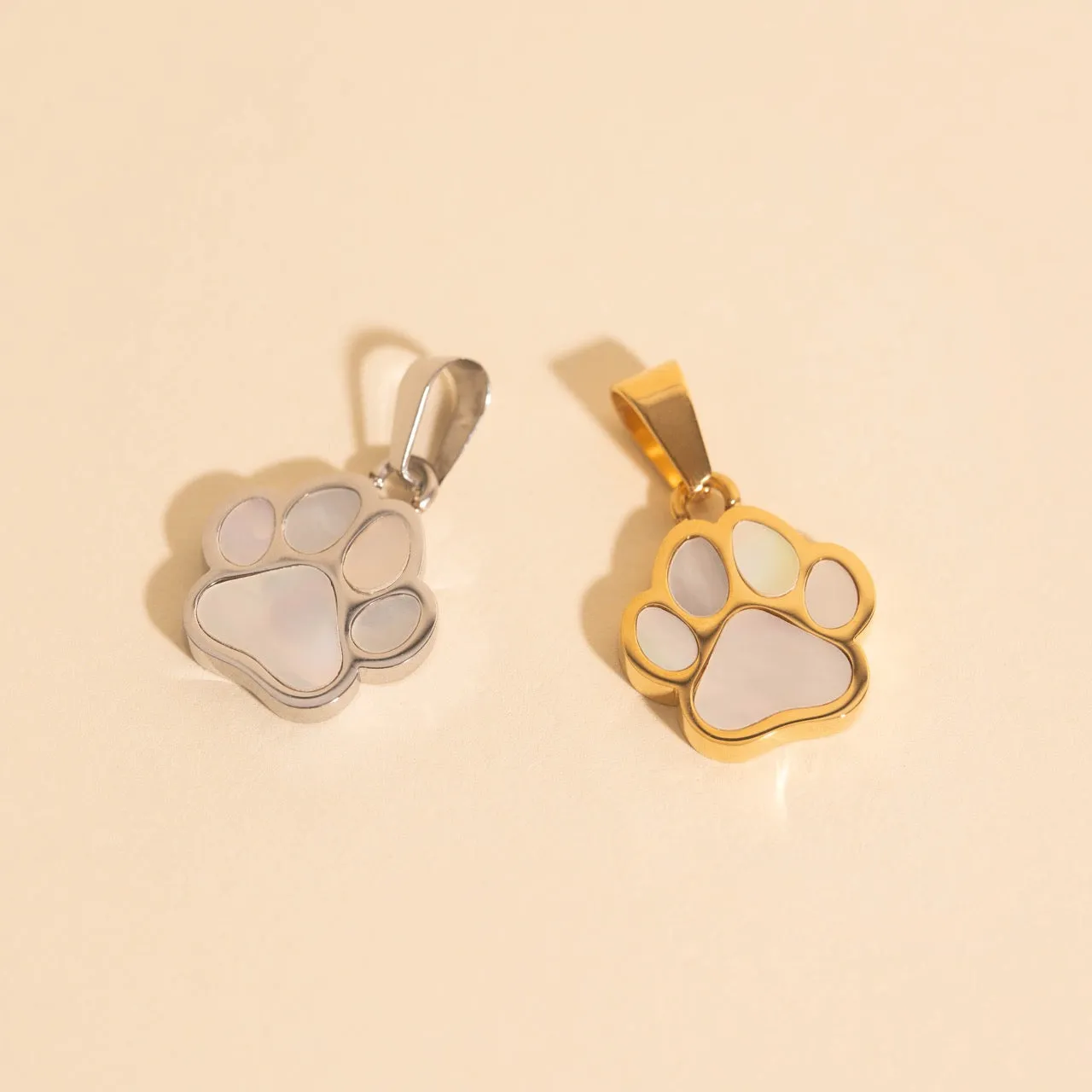 Paw Print Necklace Charm sold by Modcloth
