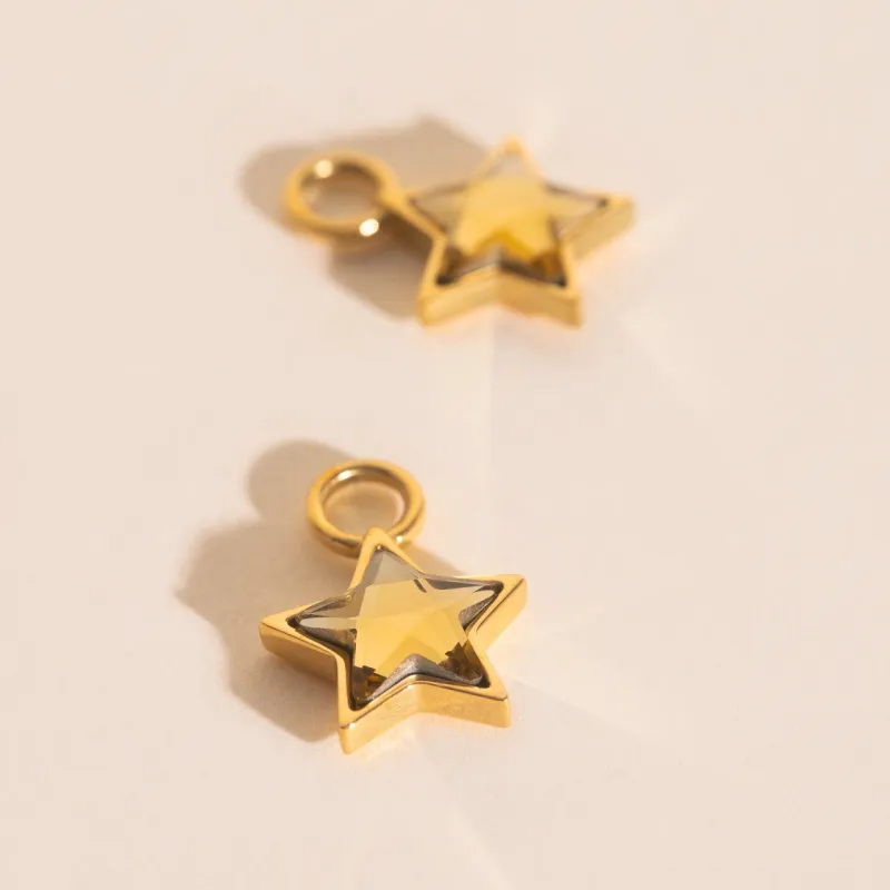 Shiny Star Huggie Hoop Charms sold by Modcloth